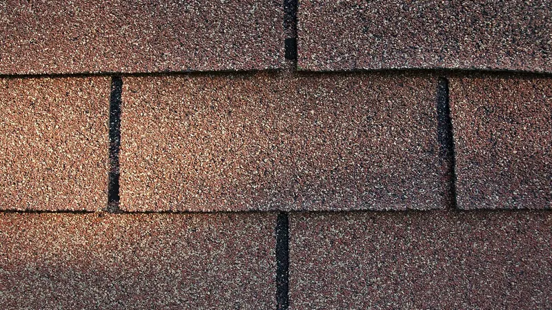 Close-up of brown asphalt roof shingles